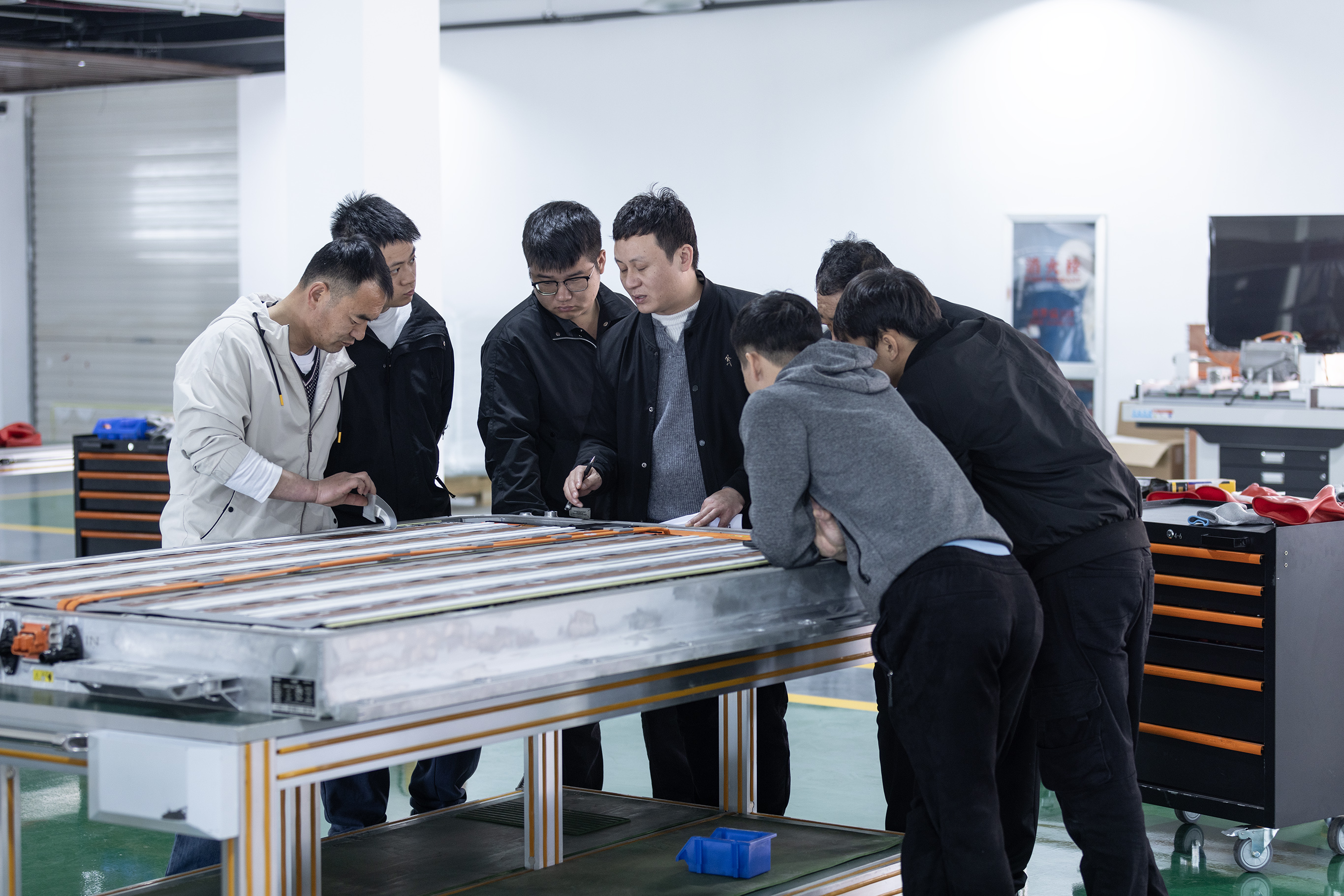 BTKX engineering team working on automotive training equipment