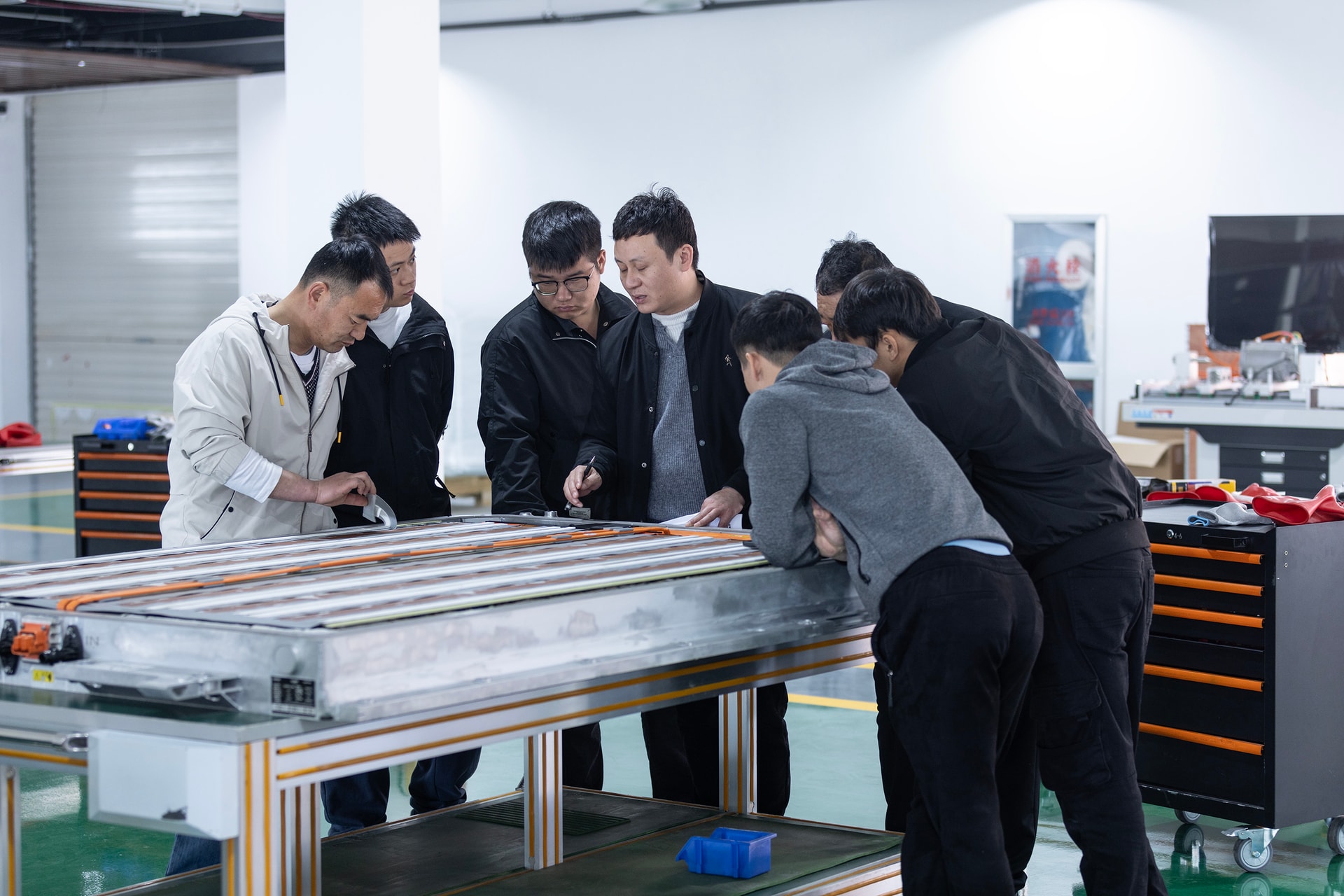 BTKX engineering team reviewing a battery training assembly