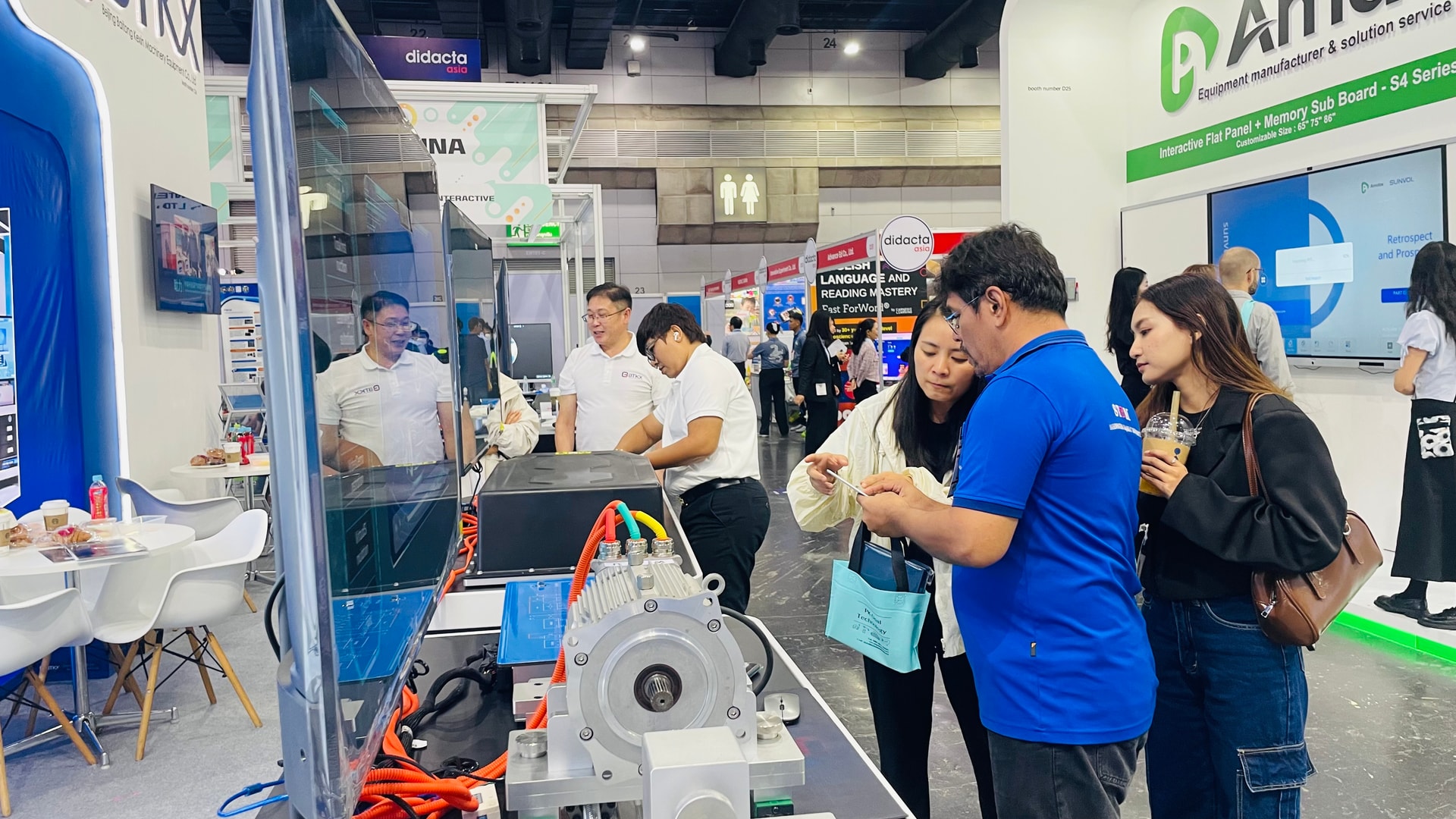 Visitors reviewing BTKX teaching equipment for course planning