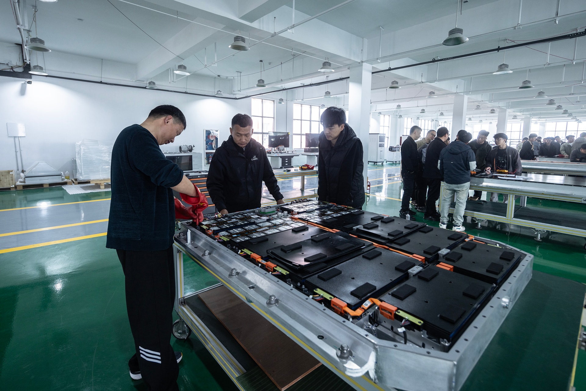 BTKX technicians reviewing a battery pack assembly